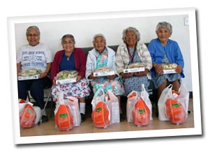 Elders with their Thanksgiving dinners.