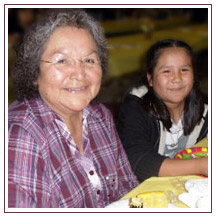 Elder and Child sharing a meal